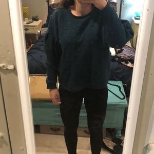 Dark green sweater with polka dots